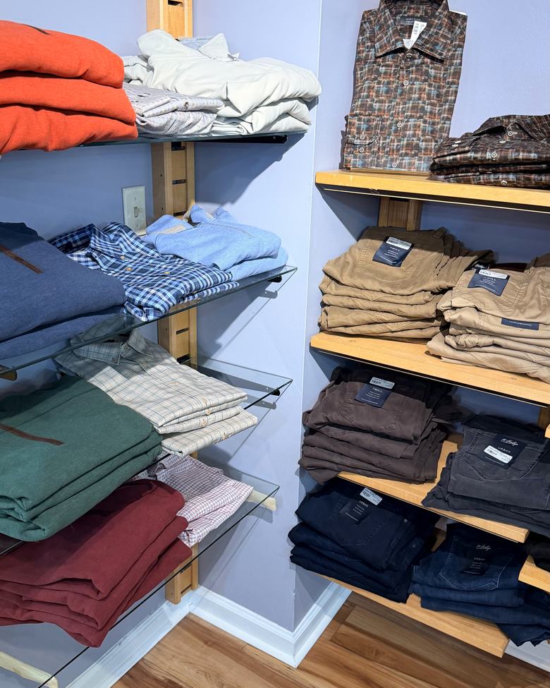 Folded shirts and knits in the corner