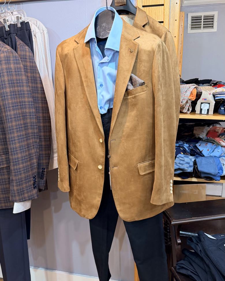 A camel suede sport coat with pocket square