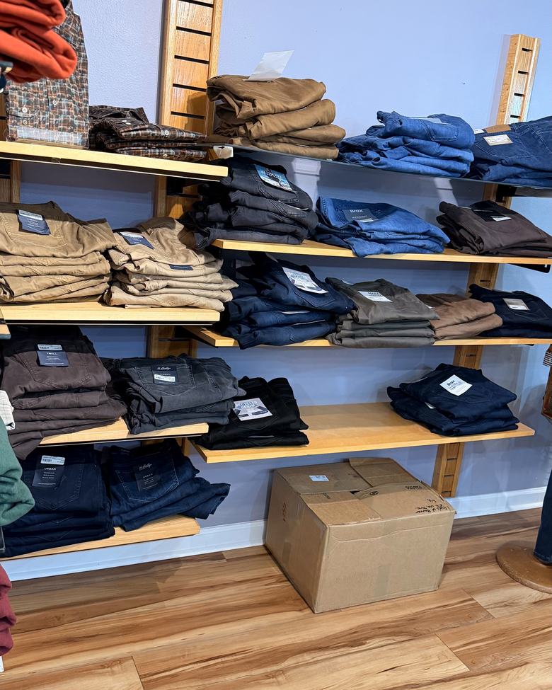 Stacks of trousers on the shelving