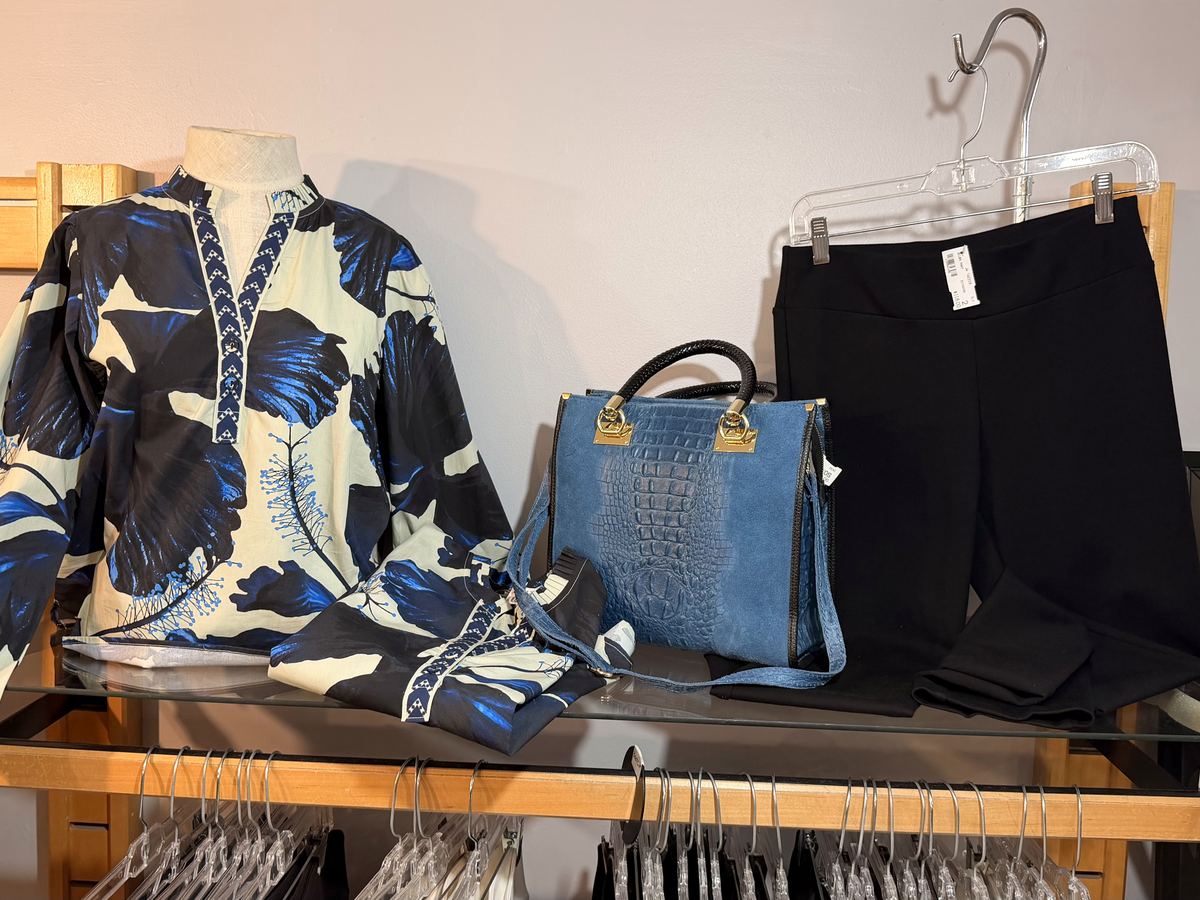 A blue floral blouse with a croc-embossed bag on the women's floor