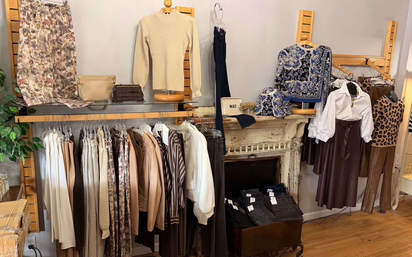 The women's floor at J.W. Tweeds, racks of tops and trousers by the mantel