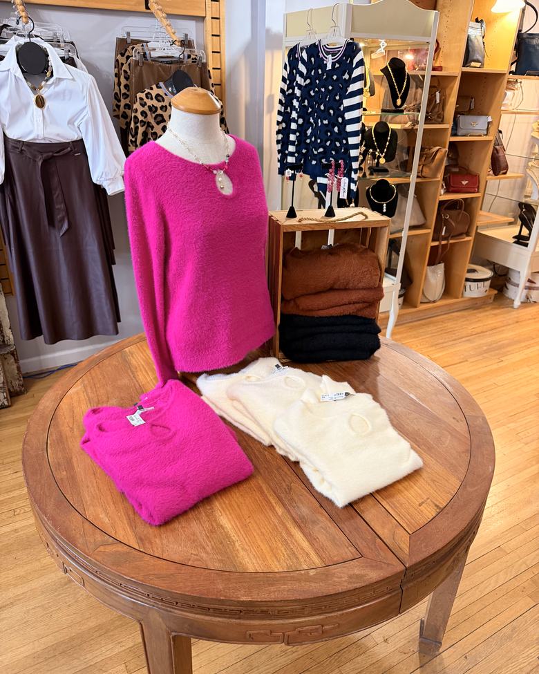 A hot pink brushed knit on the front table