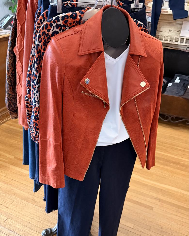 A rust moto jacket on the women's floor