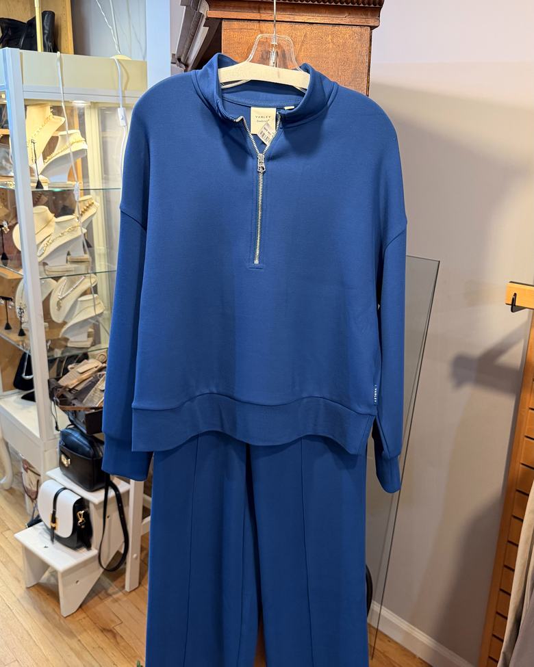 A blue Varley half-zip and trouser set